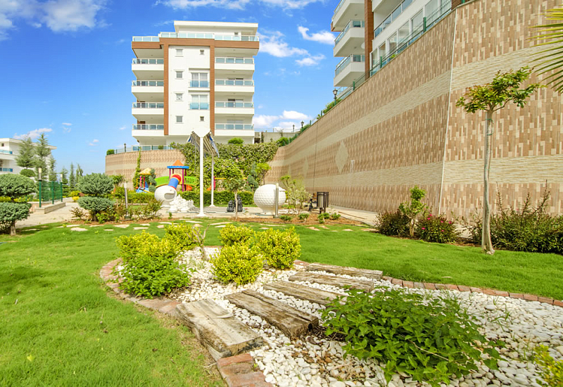 Меблированные апартаменты планировкой 2+1 в районе Каргыджак Аланья