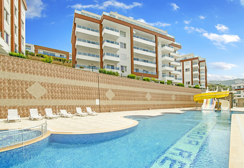 Меблированные апартаменты планировкой 2+1 в районе Каргыджак Аланья